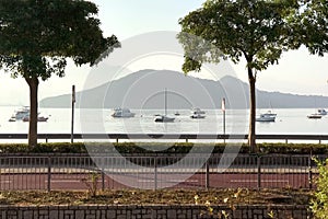 Footpath, mountain, tree, boat, sky and ocean