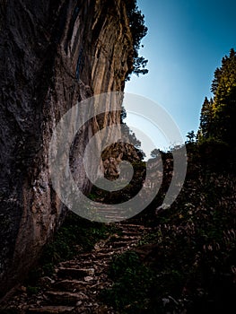 Footpath with natrual steps heading up a mountain switzerland