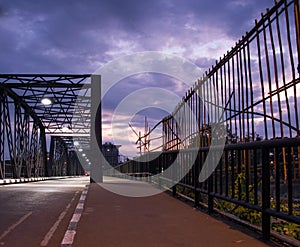 Footpath near iron bridge in early morning