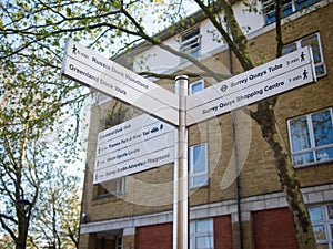 Footpath signpost indicating Russia Dock Woodland, Greenland Dock Walk, Surrey Quays Tube, etc.. London, UK