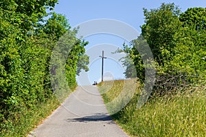 Footpath to observation point with summit cross and bench at hill Walberla in Franconian Switzerland, Germany