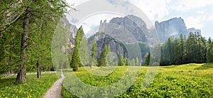 footpath to Pisciadu waterfall, spring landscape Kolfuschg, south tyrol