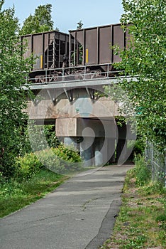 Footpath under Industrial Looking Train Bridge