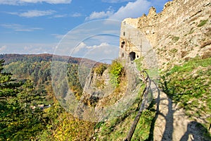 Footpath up to hrad Sasov castle ruins near Hron river during autumn