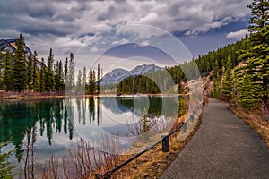 Walkway By Mount Lorette Ponds On A Cloudy Day photo