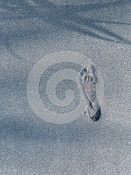 Footprint on the black sand