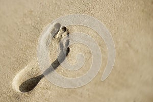 Footprint in sand.