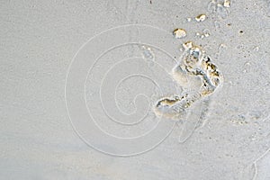 A footprint in the sand on beach