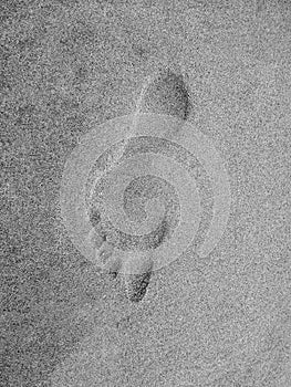 Footprint on sand beach background. Footprint on wet beach sand.