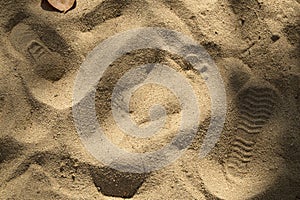 Footprint on sand beach. Walking on the beach