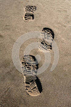 Footprint shoe on beach brown sand texture print