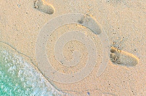 Footprints of baby on the sand