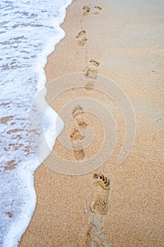 Footprints on the beach at Kaiteriteri New Zealand