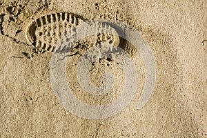 Footprints in the desert sand top