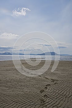 Footprints on an empty beach
