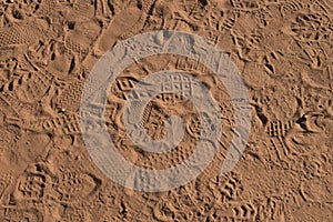 Footprints in Orange Sand