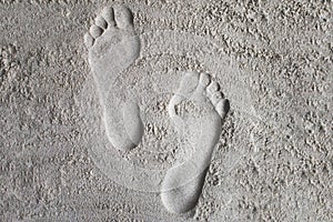 Footprints on the sand.