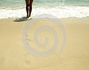 Footprints in the sand on the beach