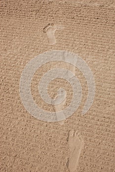 Footprints on the sand beach