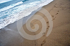 Footprints on sand beach