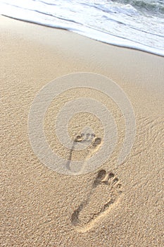 Footprints on the sand beach