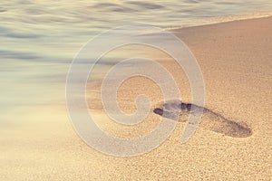 Footprints on the sand beach