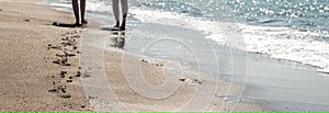 Footprints in the sand on a beautiful beach