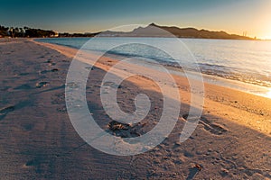 Footprints in the sand, beautiful summer beach Playa de Muro. Mallorca