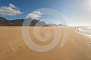 Footprints in sand on Cofete beach, Fuerteventura island