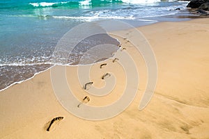 Footprints in the sand photo