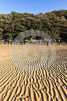 Footprints in sand during low tide