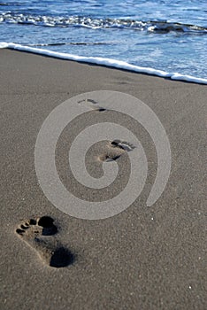 Footprints on sand at Parantritis Beach.