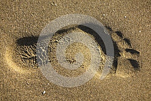 Footprints in the sand at sunset, Antalya beach