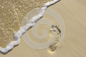 Footstep on the sand photo