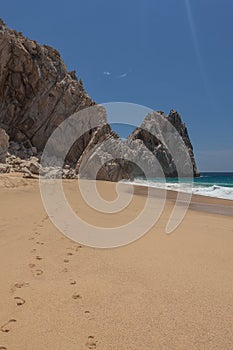 Footsteps in the sand at Lovers Beach in Cabo San Lucas, Mexico