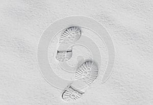 Footsteps in the snow, boot mark close up outdoor