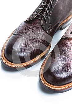 Footwear Ideas. Extreme Closeup of Toes of Premium Dark Brown Grain Brogue Derby Boots Made of Calf Leather with Rubber Sole