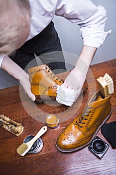 Footwear Ideas. Professional Male Shoes Cleaner Polishing Male Tan Brogue