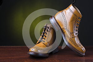 Footwear and shoes concepts. Pair of premium tanned brogue derb