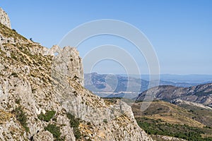 Forata rock hole with the city of Cocentaina in the background, Aitana mountain photo