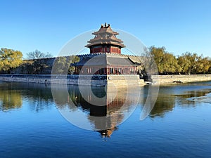 The Forbidden City turret and its reflection in the moat