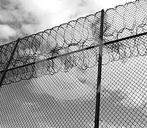 Forbidding fence with razor wire