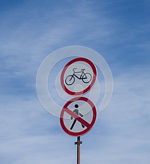 forbidding road signs on a blue sky background