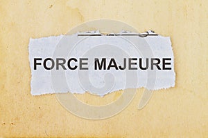 Force Majeure newspaper cut out with a vintage paper background