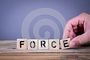 Force. Wooden letters on the office desk