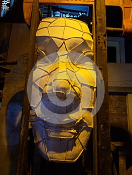 This is a forced man`s face sculpture.Which is surrounded by troubles