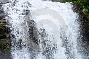 Forceful Fall of Water with Sprinkling of White Water Drops - Cheeyappara Waterfalls, Idukki, Kerala, India