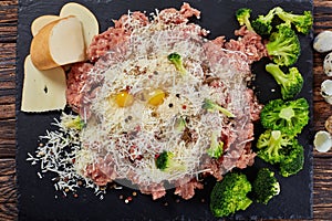 Forcemeat, broccoli, cheese, eggs, spices mixture