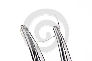 Forceps with suture kit