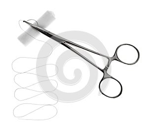 Forceps with suture thread and bandage roll on white, top view. Medical equipment